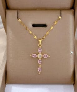 Pink pendant cross necklace worn on model – stylish and spiritual