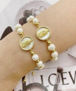 Fashionable pearl bracelet featuring Virgin Mary charm