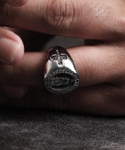 Close-up detail of Virgin Mary engraving on titanium ring