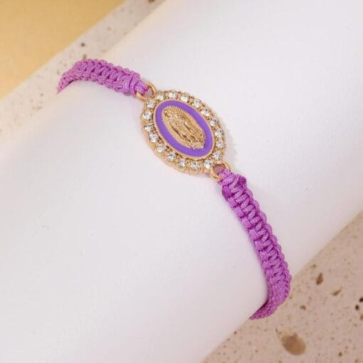 Purple Virgin Mary charm bracelet symbolizing peace and faith