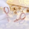 Rose gold drop earrings with cross design
