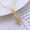 Crystal cross necklace with gold and white inlay